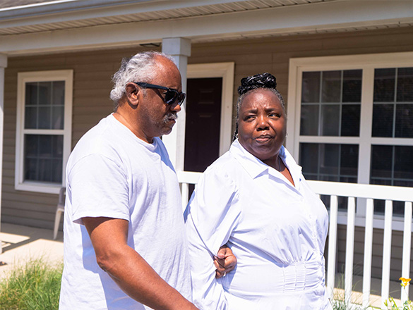 Older couple walking in neighborhood