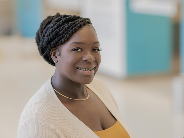 Young woman smiling at the camera for Dermatology page