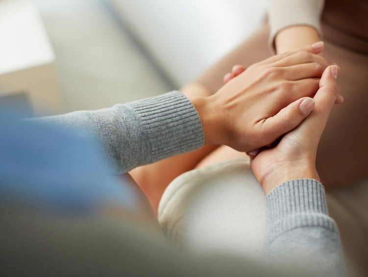 Closeup of hands being held in support