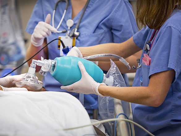 Clinical staff performing live-saving measures