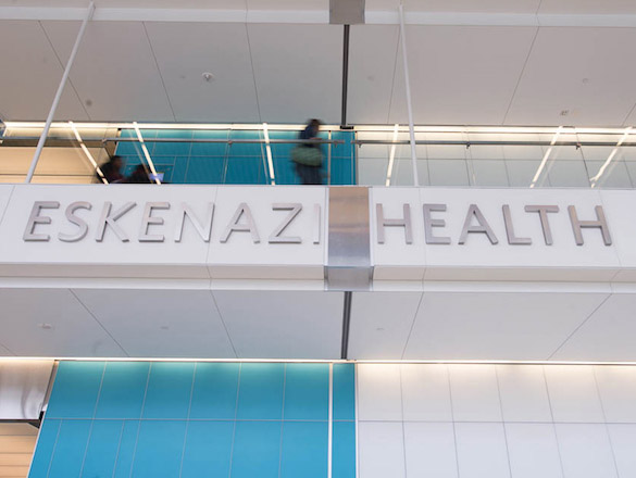 Interior view of Eskenazi Health downtown facility with Eskenazi Health lettering on wall