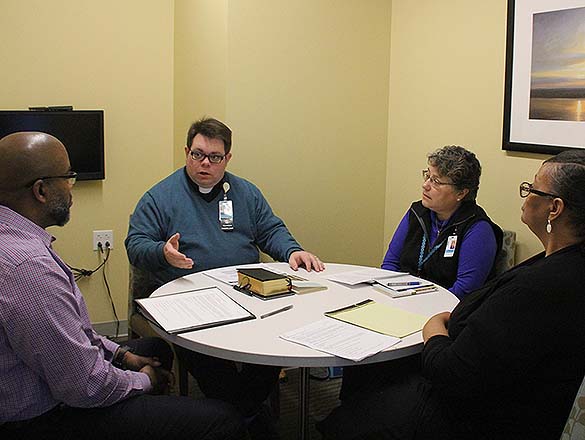 Four Chaplains Having a Discussion at a Table