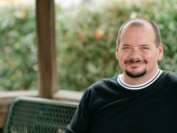 A man smiling at the camera