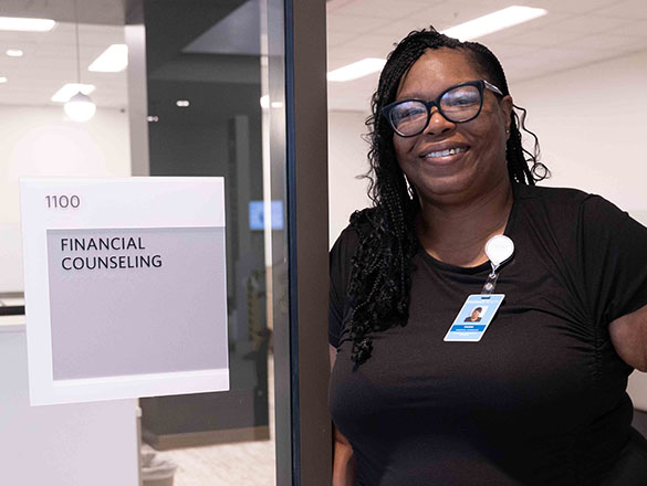 Woman Smiling in the Doorway of a Financial Counseling Suite