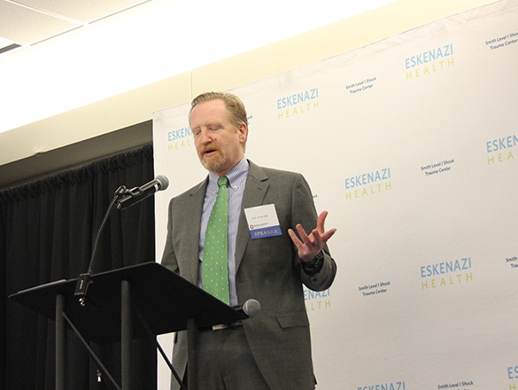 An Eskenazi Health trauma doctor speaking at a conference
