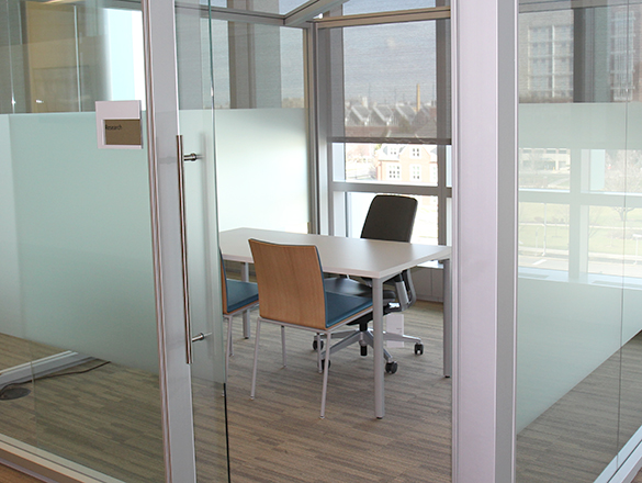 Empty Glass Room with Table and Chairs